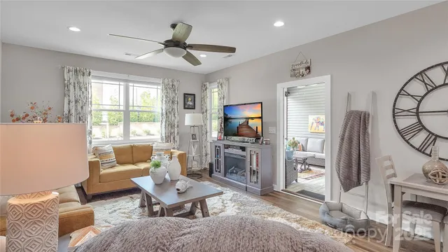 a living room with furniture and a potted plant