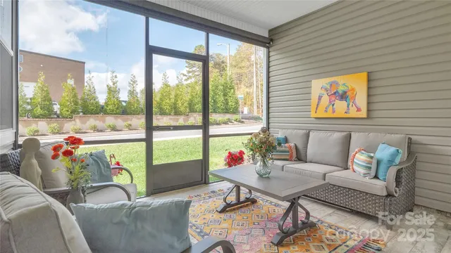 a living room with a couch and piano table