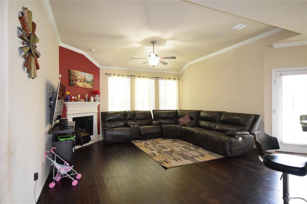 12421 Hitch Rack Way McKinney, TX 75071 - Photo 2 of 21 a living room with furniture and a flat screen tv