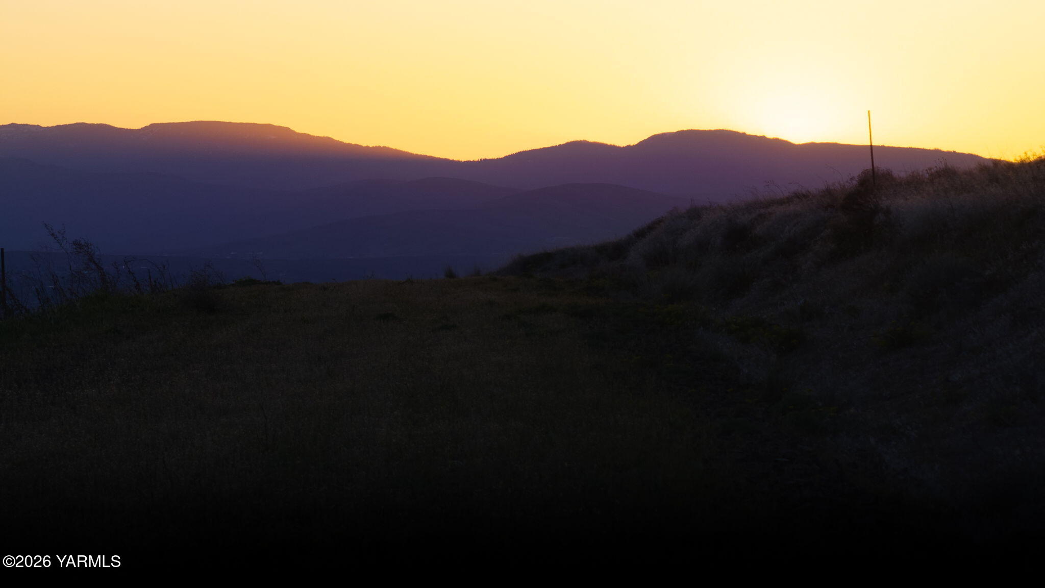 Nna Eagle Way Yakima, WA 98901 - Photo 18 of 19 a view of a house with a field