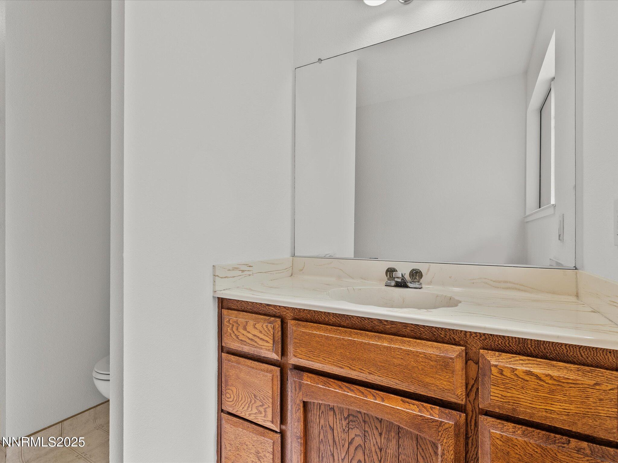 5 Ute Court Stateline, NV 89449 - Photo 33 of 59 a bathroom with a granite countertop sink and a mirror