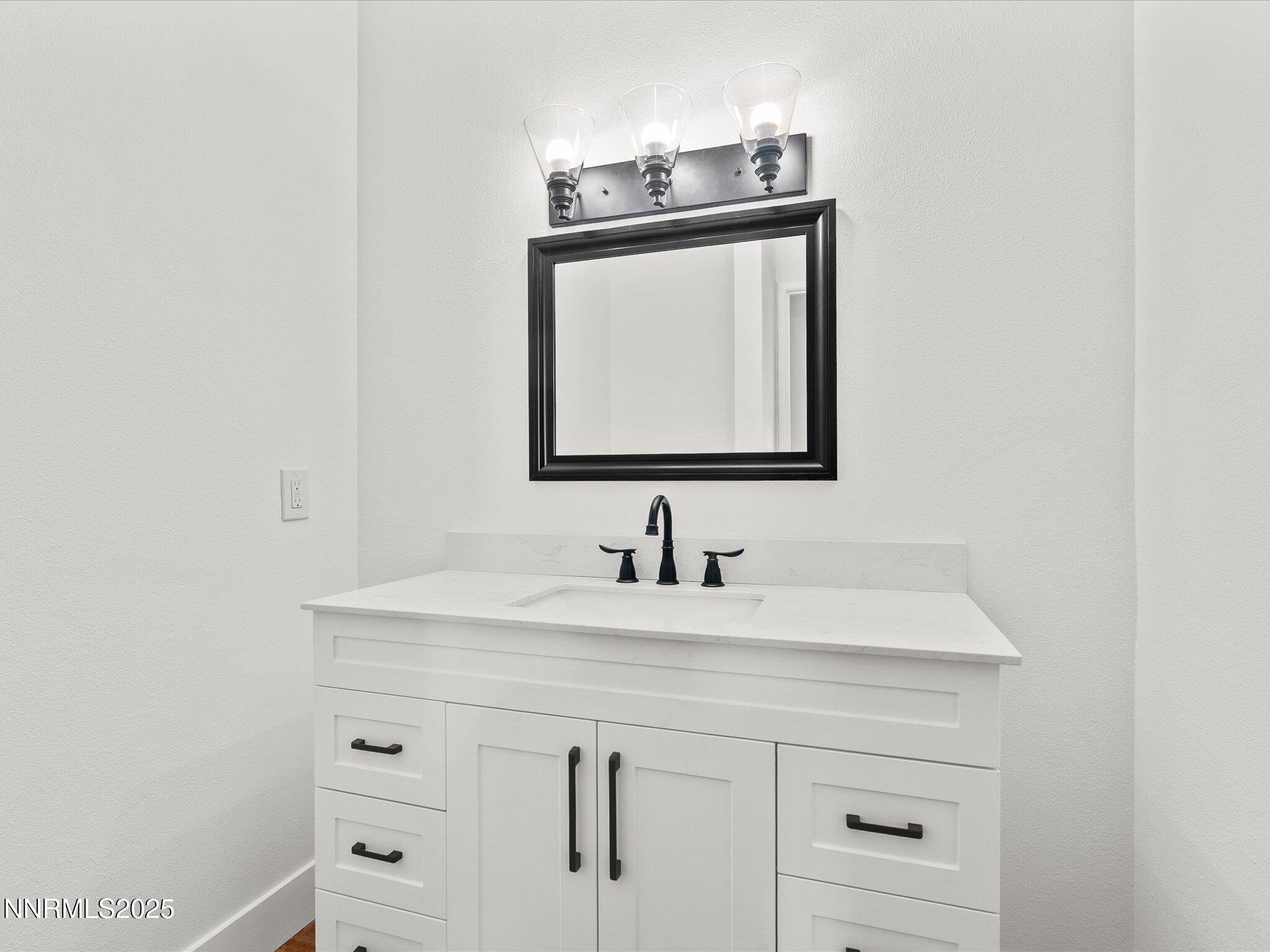 5 Ute Court Stateline, NV 89449 - Photo 7 of 59 a bathroom with a sink and a mirror