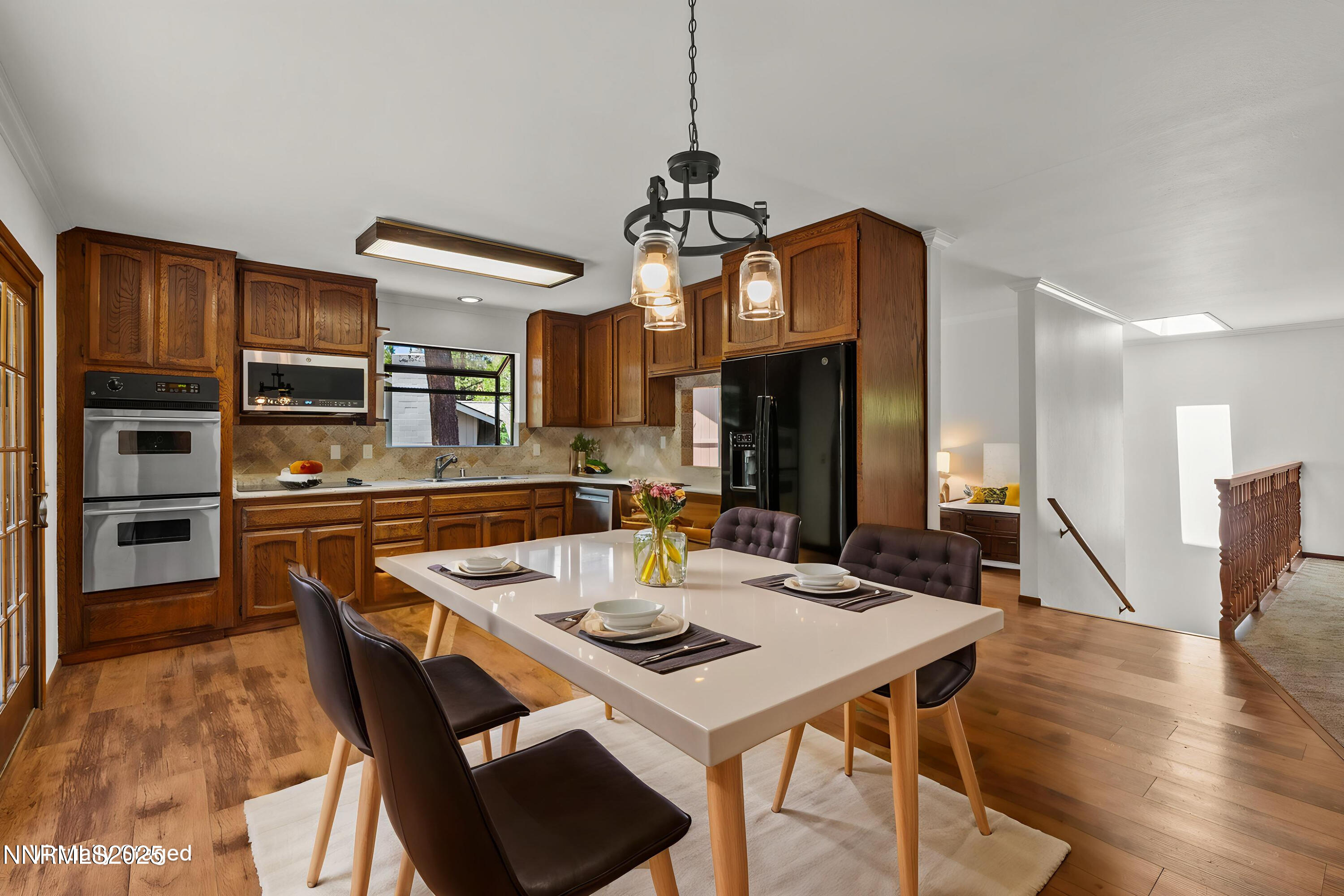 5 Ute Court Stateline, NV 89449 - Photo 8 of 59 a view of a dining room with furniture a kitchen and chandelier