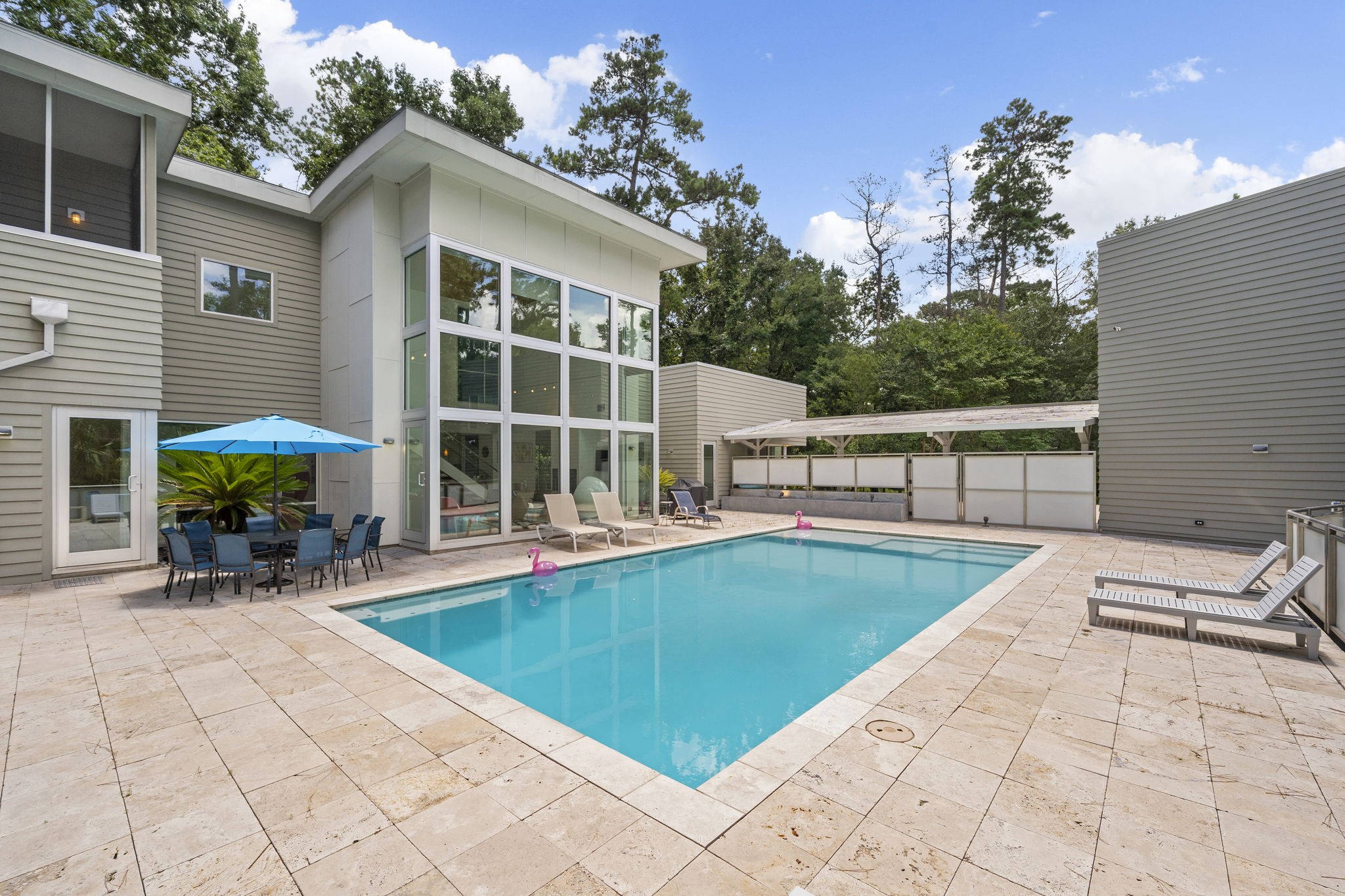 118 Angel Leaf Road The Woodlands, TX 77380 - Photo 38 of 50 Resort-style living with expansive pool deck and sleek exterior lines.