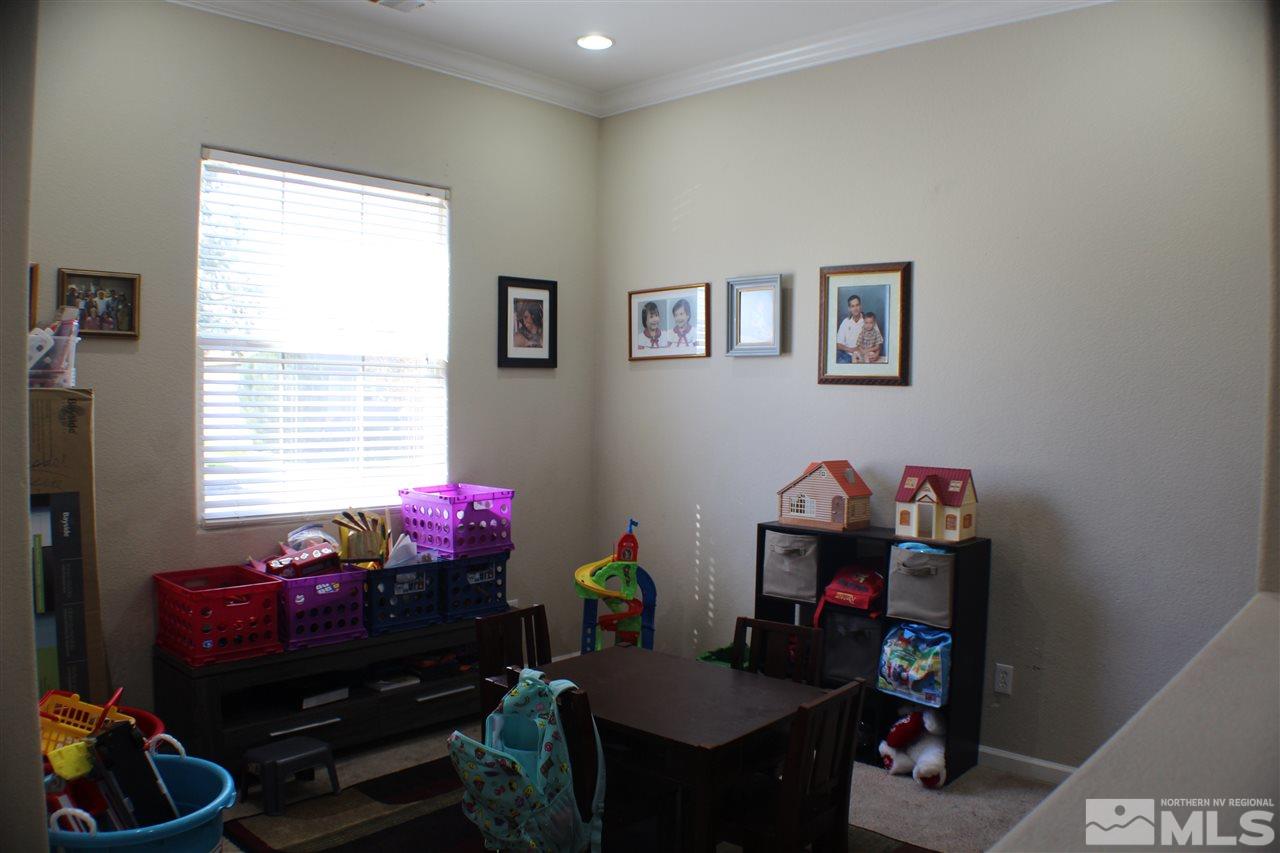 10558 Crystal Bay Drive Reno, NV 89521 - Photo 11 of 16 a room that has a couch and a dresser in it