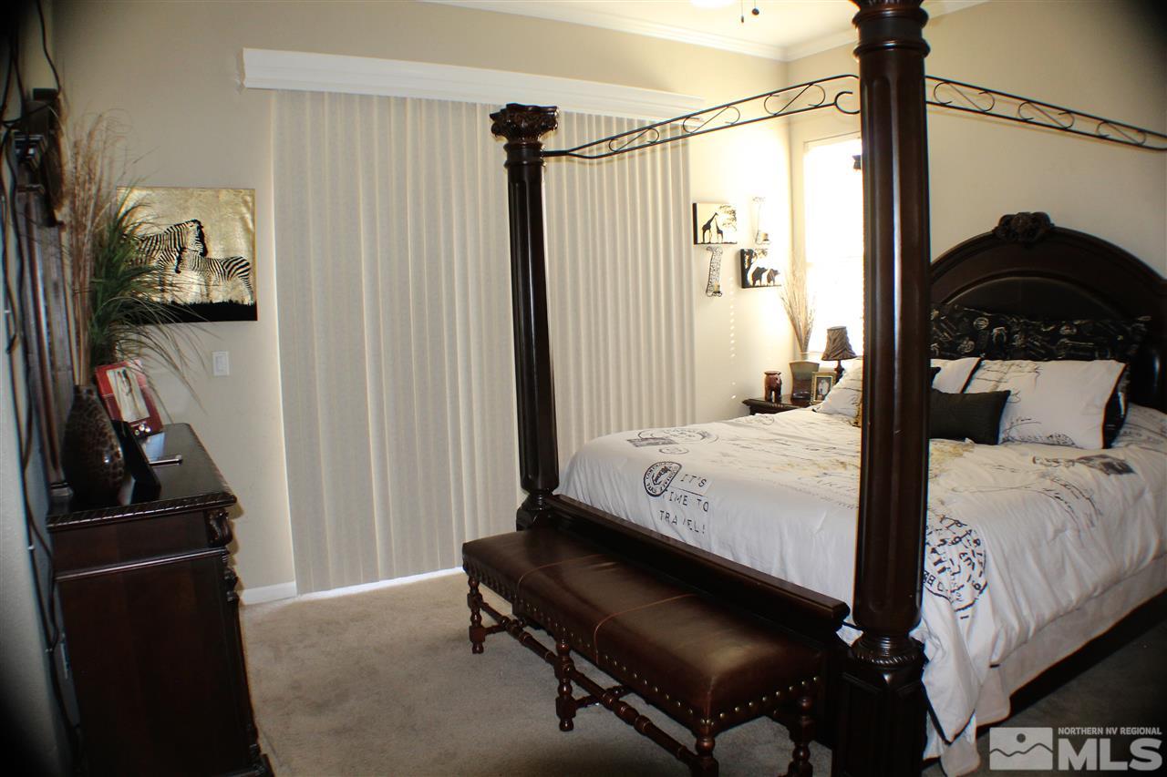 10558 Crystal Bay Drive Reno, NV 89521 - Photo 13 of 16 a bedroom with a bed and a window
