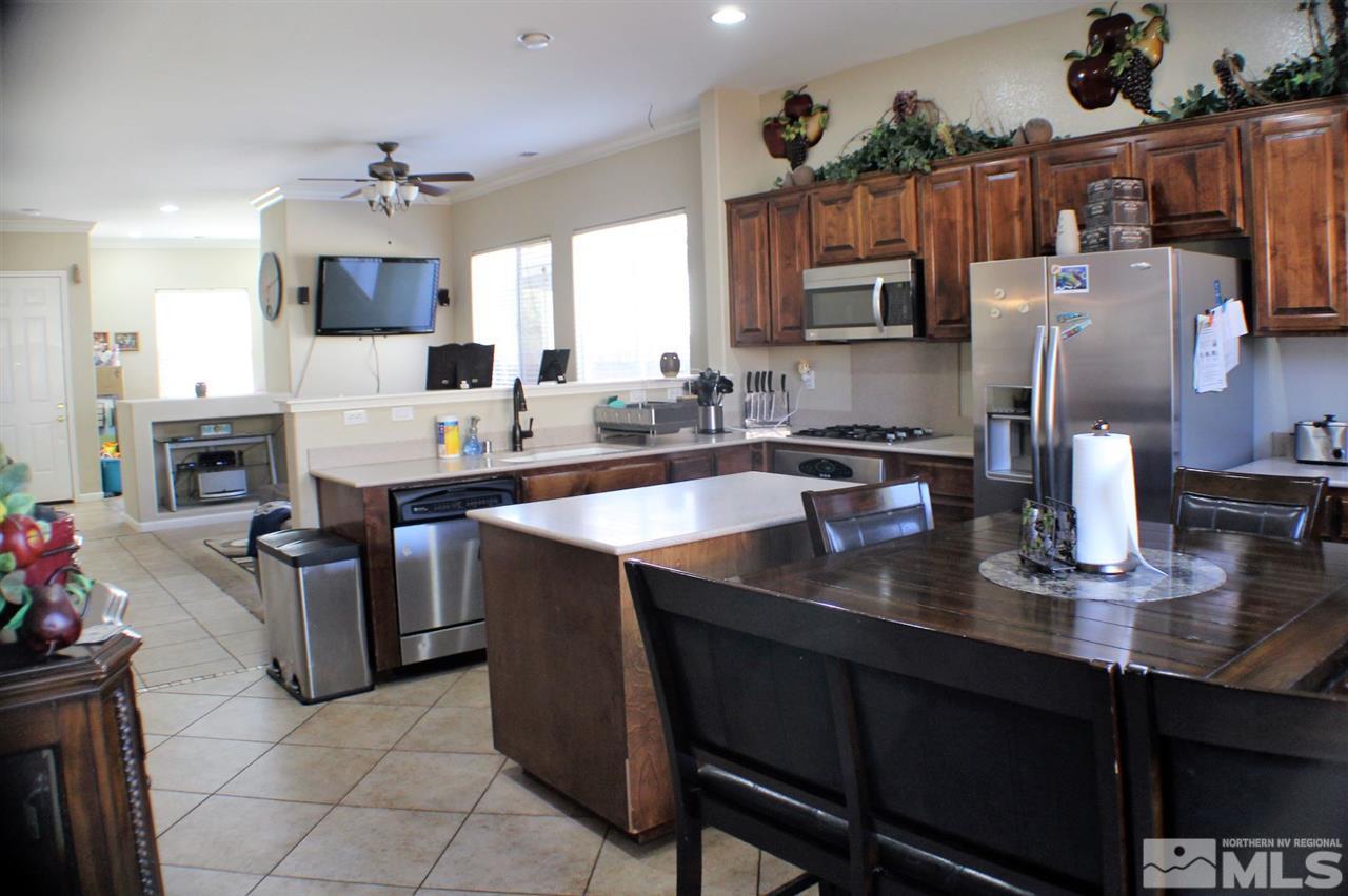10558 Crystal Bay Drive Reno, NV 89521 - Photo 3 of 16 a kitchen with cabinets a sink and appliances