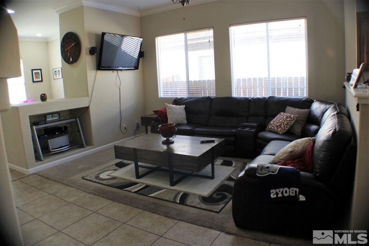 10558 Crystal Bay Drive Reno, NV 89521 - Photo 4 of 16 a living room with furniture and a fireplace