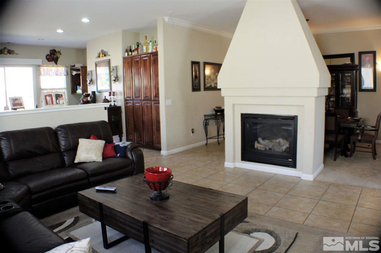 10558 Crystal Bay Drive Reno, NV 89521 - Photo 6 of 16 a living room with furniture and a fireplace