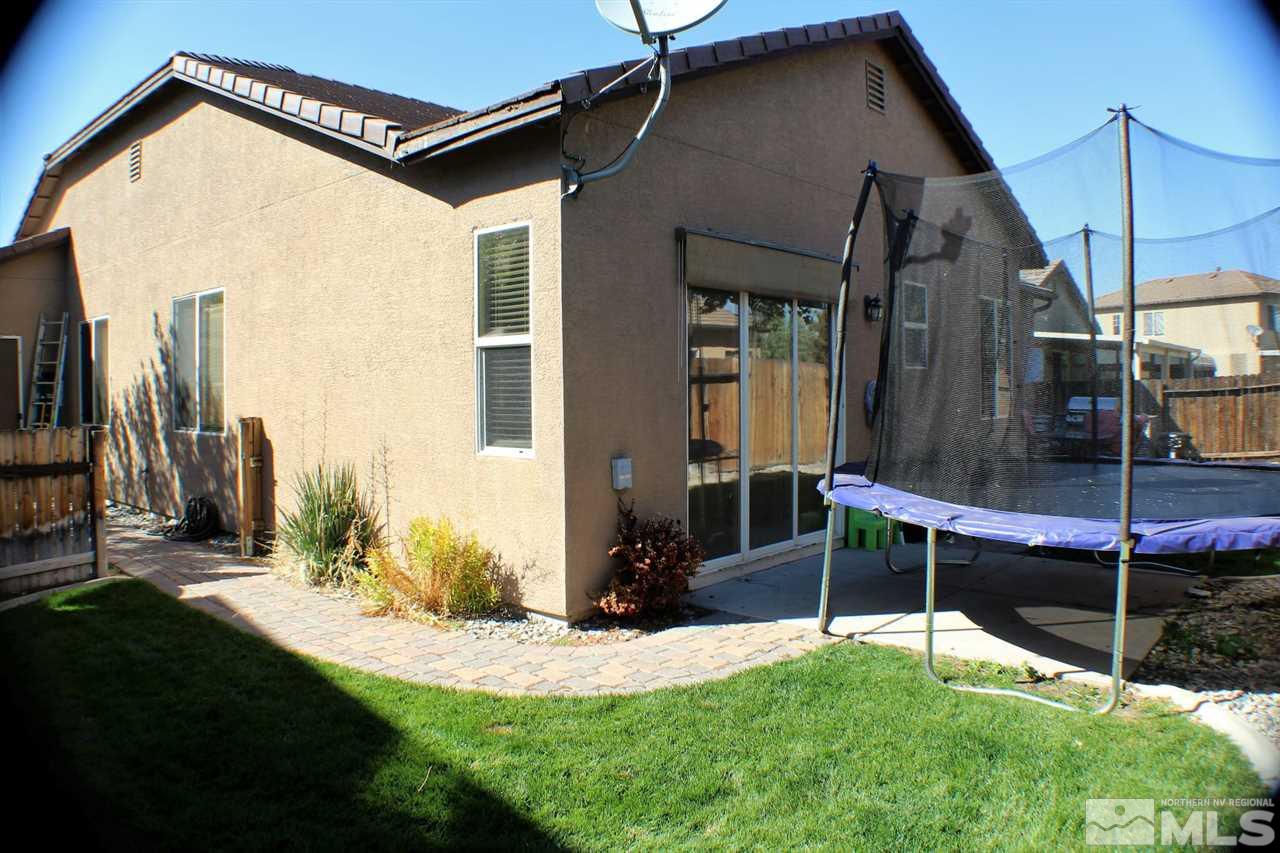 10558 Crystal Bay Drive Reno, NV 89521 - Photo 10 of 16 a backyard of a house with table and chairs