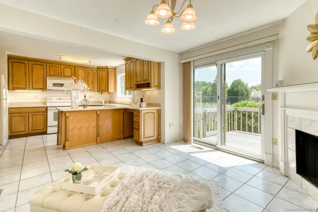 a open kitchen with a sink and a stove top oven