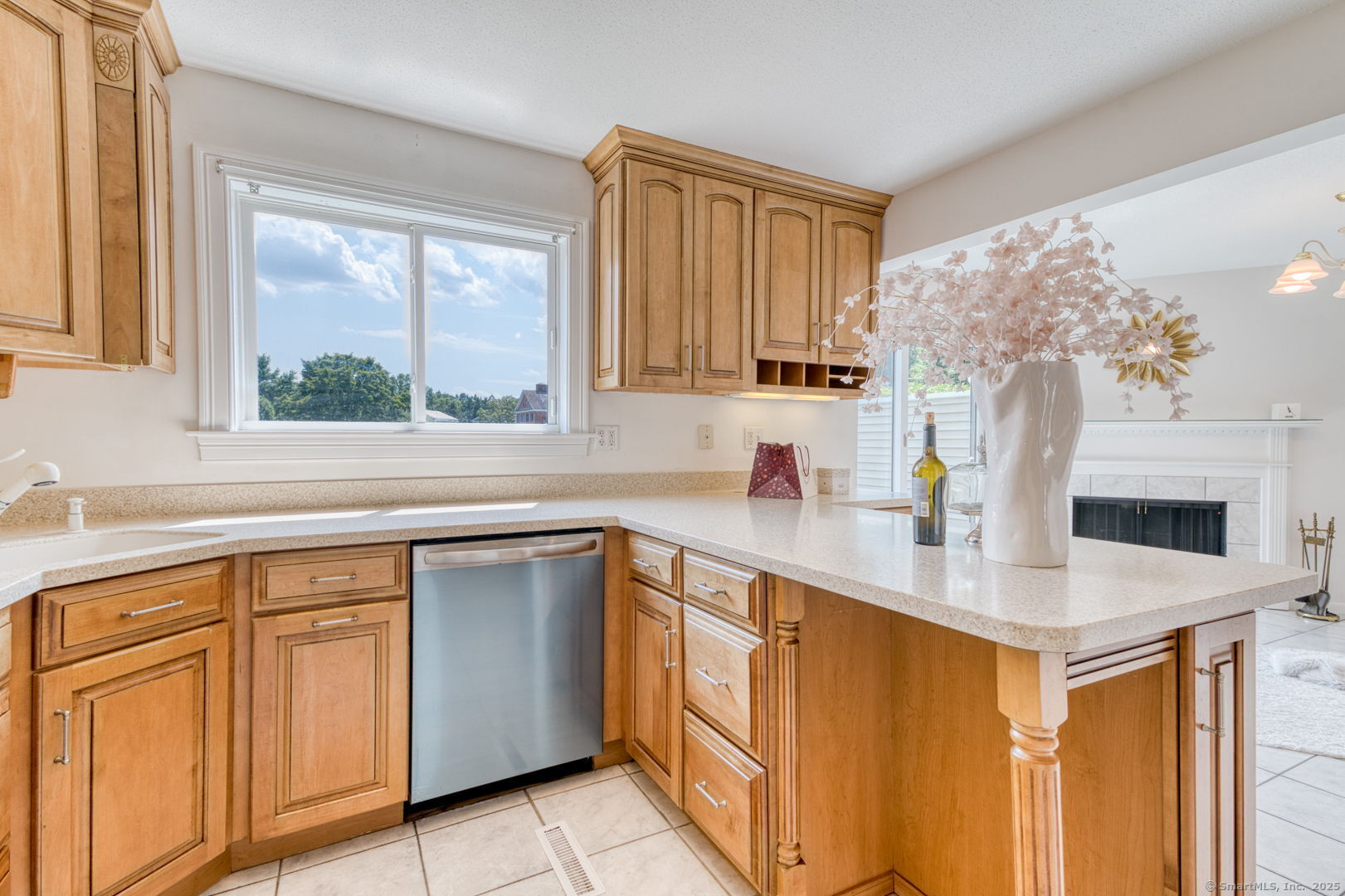 592 Mountain Road, Unit A West Hartford, CT 06117 - Photo 16 of 40 a kitchen with stainless steel appliances white cabinets a sink and a large window