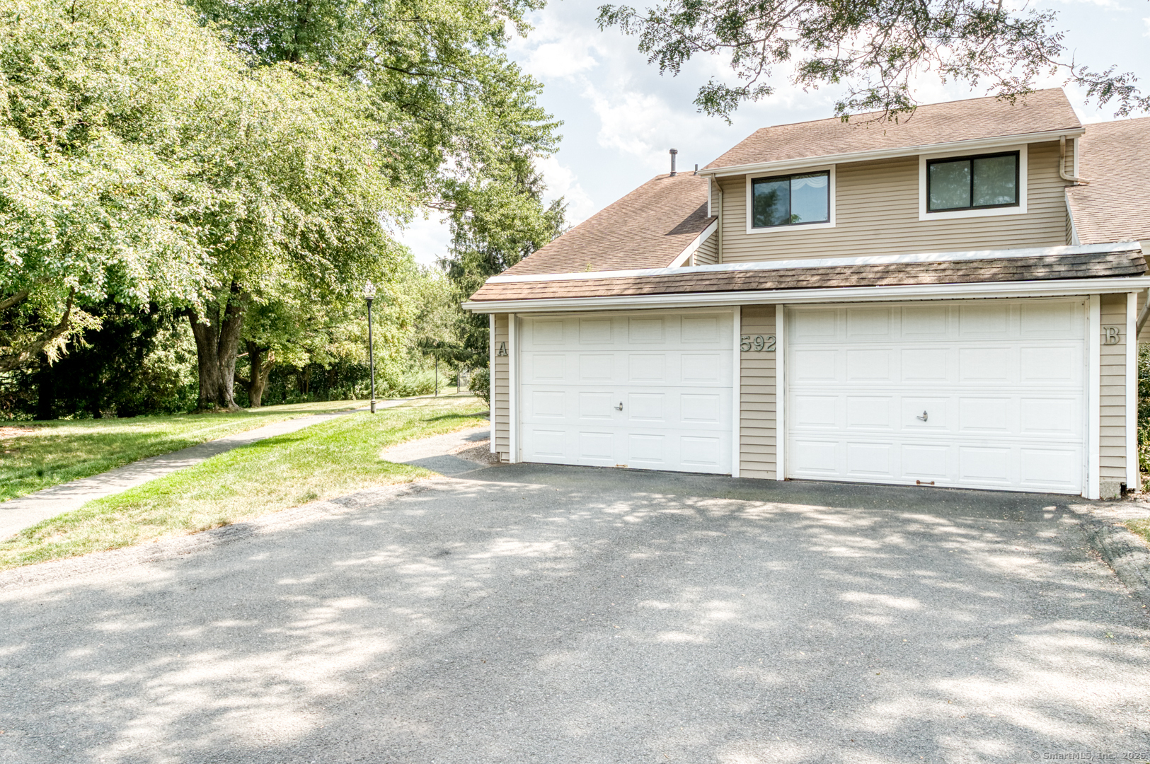 592 Mountain Road, Unit A West Hartford, CT 06117 - Photo 2 of 40 a house view with a outdoor space