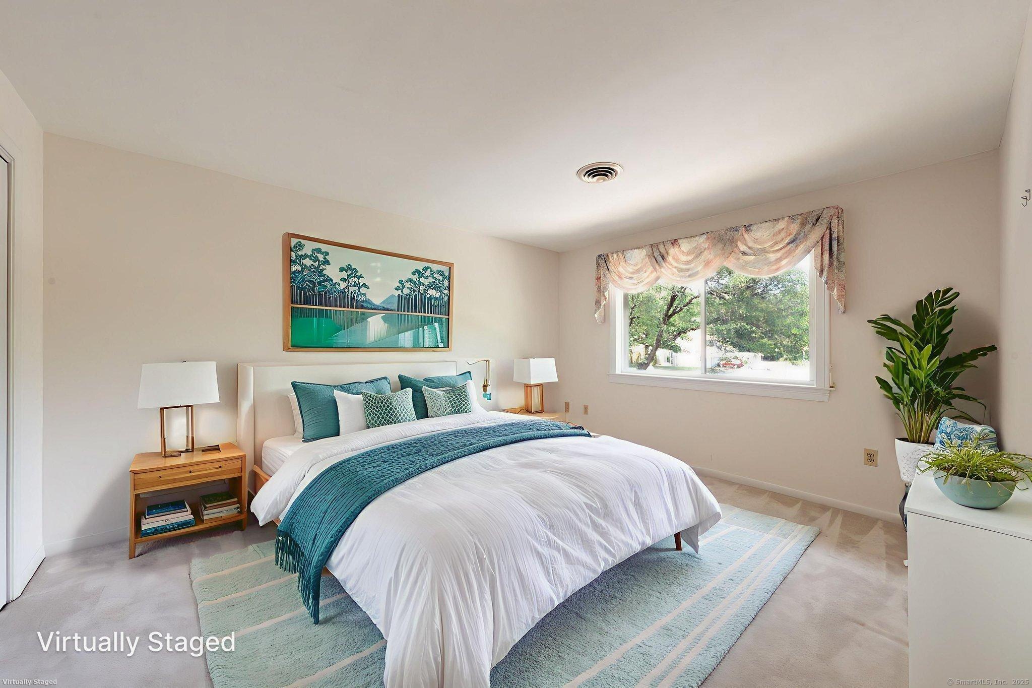 592 Mountain Road, Unit A West Hartford, CT 06117 - Photo 22 of 40 a bed room with a bed and a potted plant