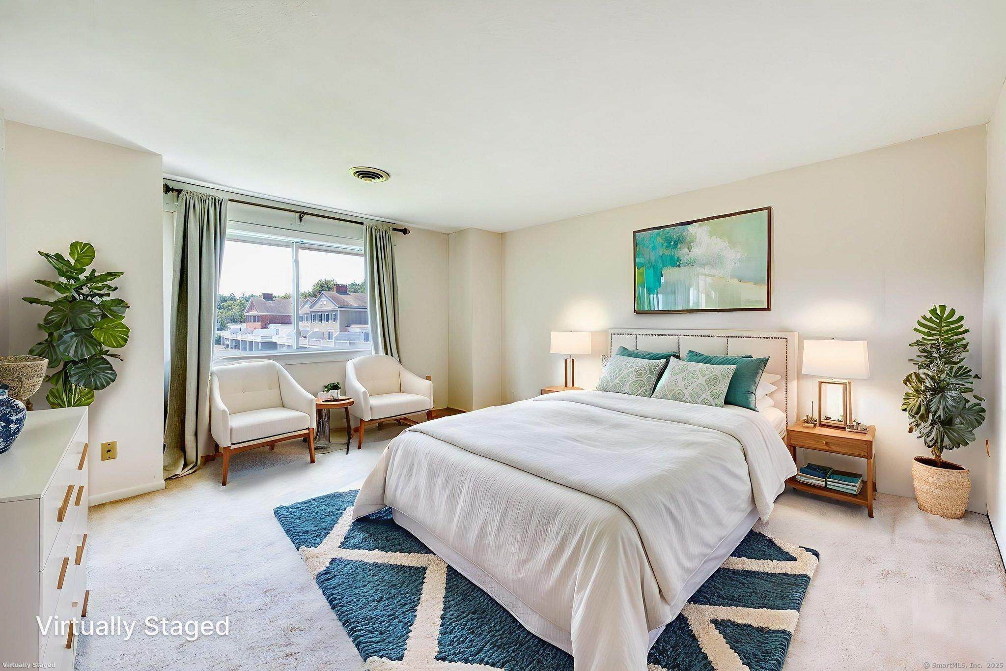 592 Mountain Road, Unit A West Hartford, CT 06117 - Photo 25 of 40 a bedroom with a bed and a large window