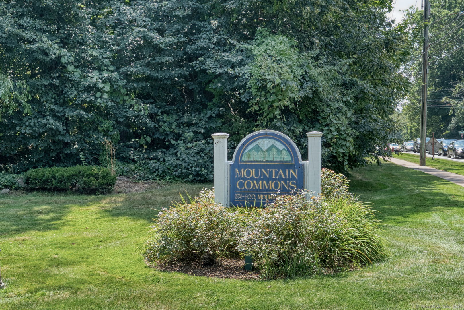 592 Mountain Road, Unit A West Hartford, CT 06117 - Photo 40 of 40 a sign that is sitting in front of a tree