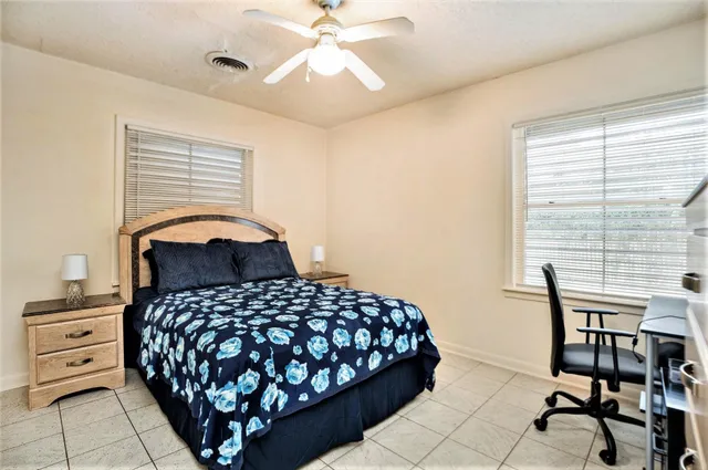 a bedroom with a bed and a table in it