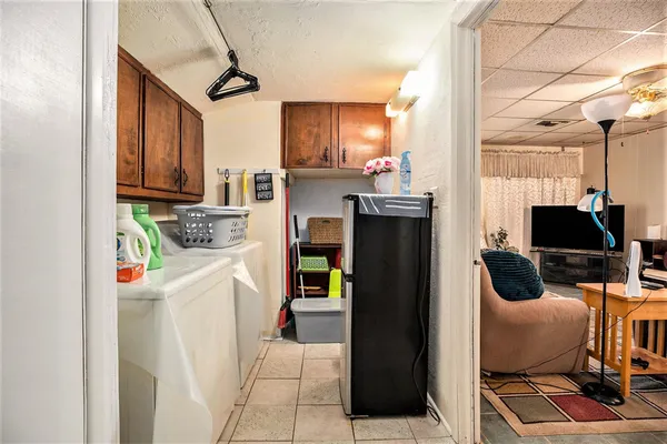 a kitchen with stainless steel appliances a refrigerator and a stove top oven