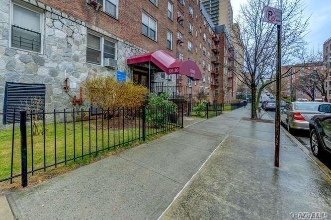 a view of a building with a yard