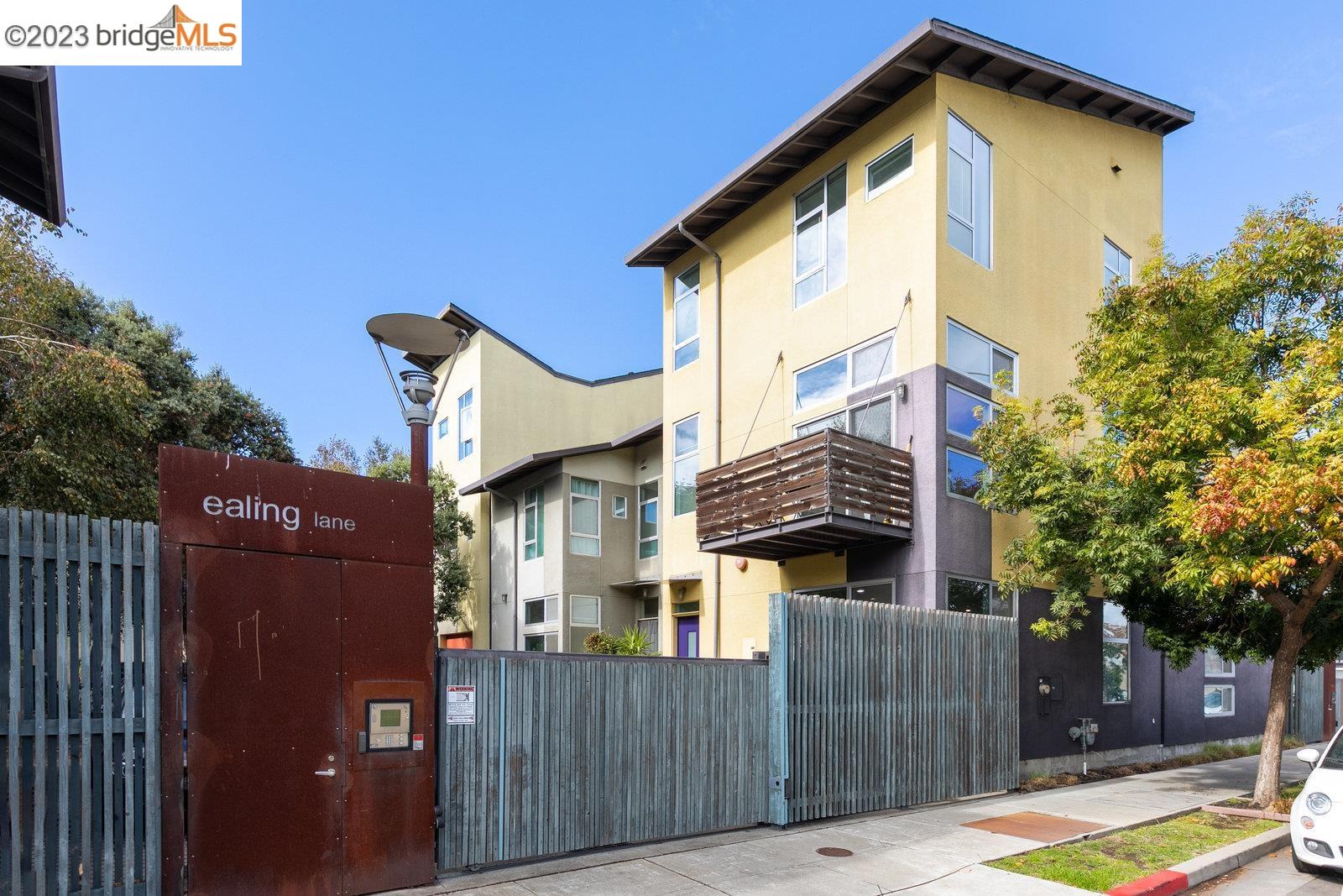 a view of a house with wooden fence