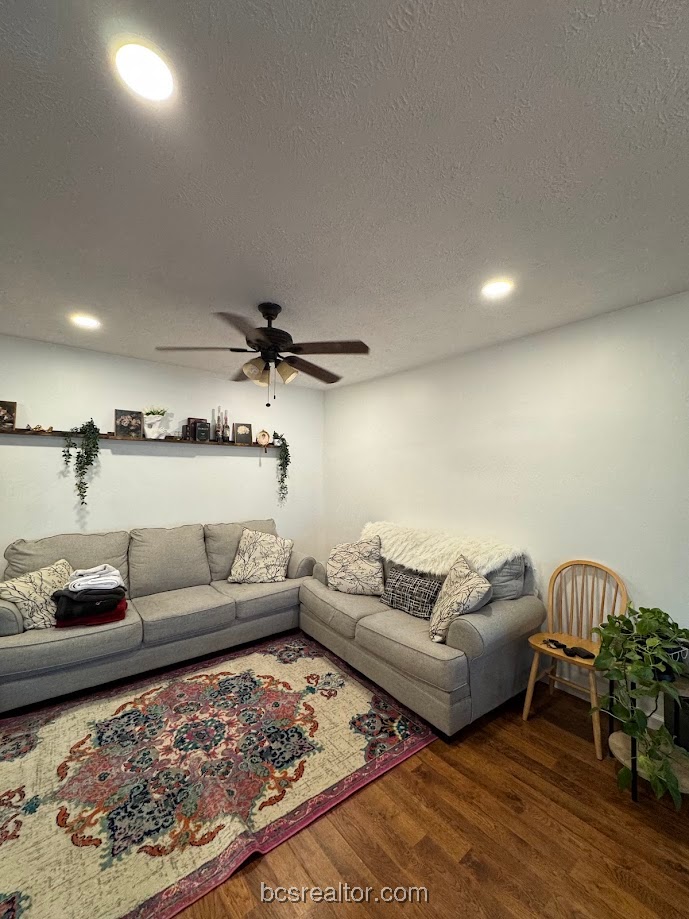 1101 East 30th Street Bryan, TX 77802 - Photo 19 of 42 a living room with furniture and a rug