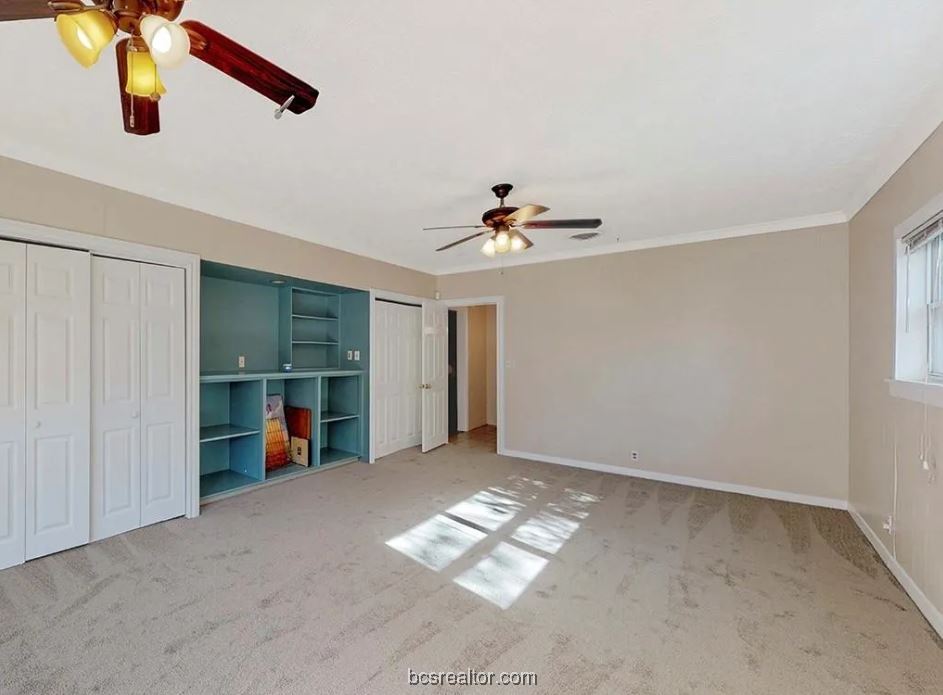 1101 East 30th Street Bryan, TX 77802 - Photo 29 of 42 a view of an empty room with window and cabinet
