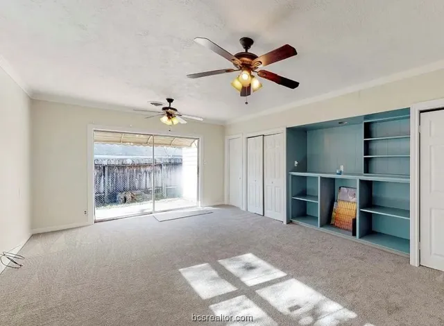 a view of an empty room with a window