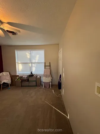 a view of livingroom with furniture and windows