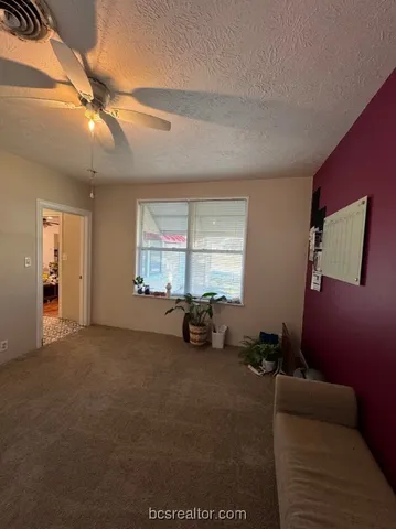 a view of livingroom with furniture and windows