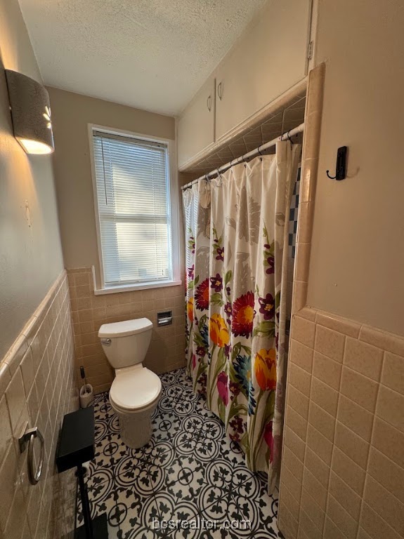 1101 East 30th Street Bryan, TX 77802 - Photo 39 of 42 a bathroom with a sink toilet and shower