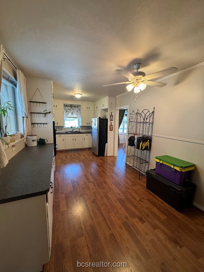1101 East 30th Street Bryan, TX 77802 - Photo 7 of 42 a living room with furniture and a wooden floor