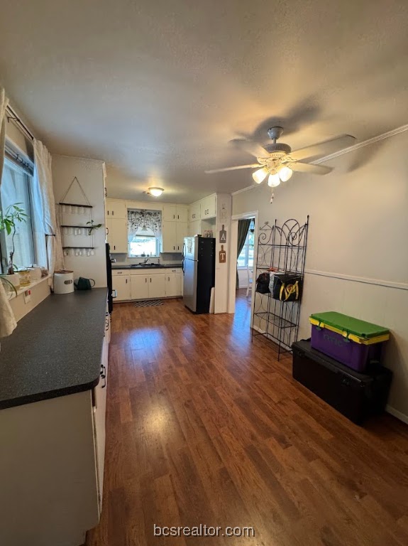 1101 East 30th Street Bryan, TX 77802 - Photo 7 of 42 a living room with furniture and a wooden floor