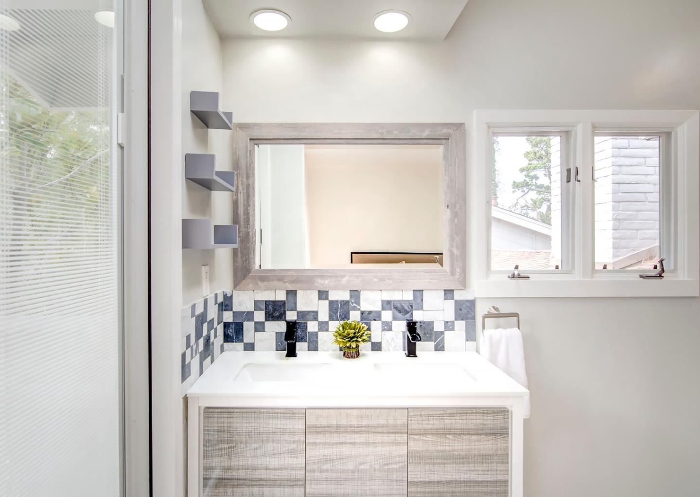 4143 Crest Road Pebble Beach, CA 93953 - Photo 14 of 20 a bathroom with a sink and a window