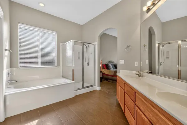a bathroom with a sink a mirror and a bathtub
