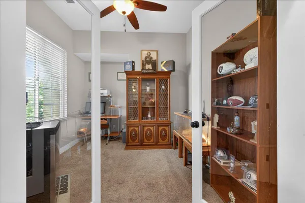 a living room with furniture and a closet