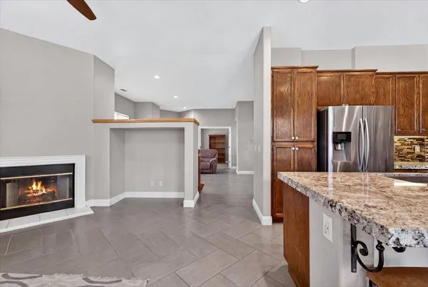 a view of a kitchen cabinets and a refrigerator
