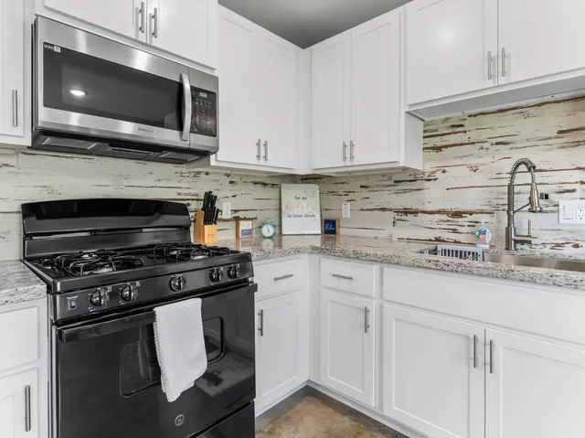 a kitchen with a refrigerator and a cabinets