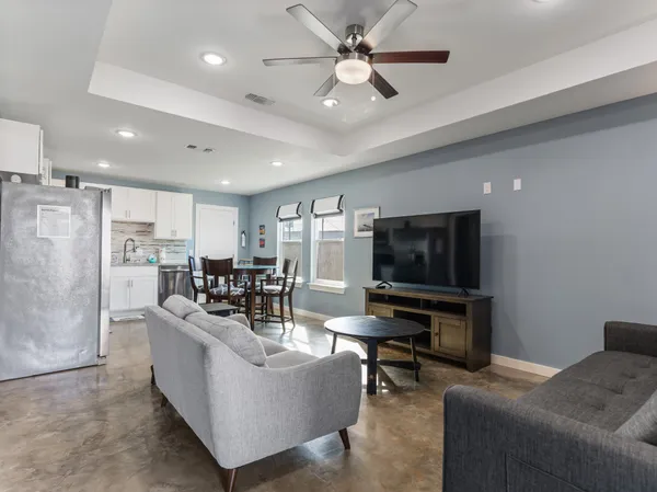 a view of a dining room with furniture and a window