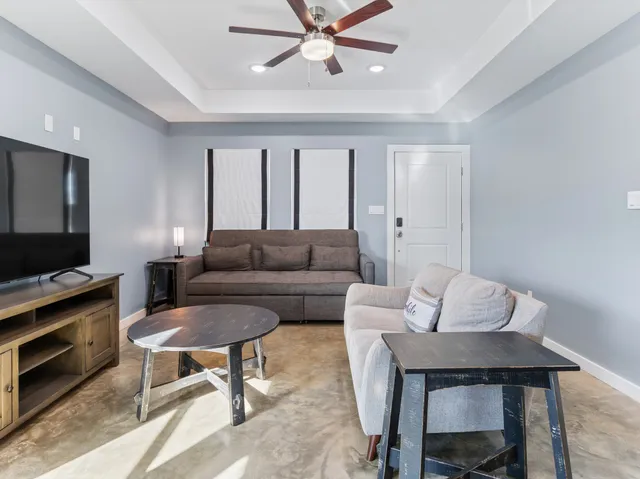 a view of kitchen with dining area refrigerator and wooden floor