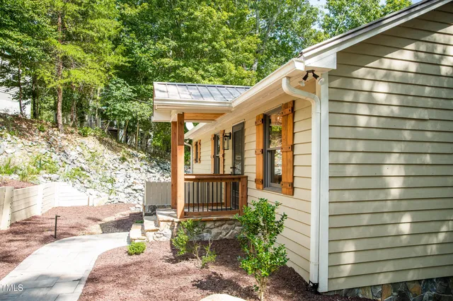 a view of a backyard with a large tree