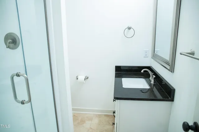 a view of a house with a wooden deck