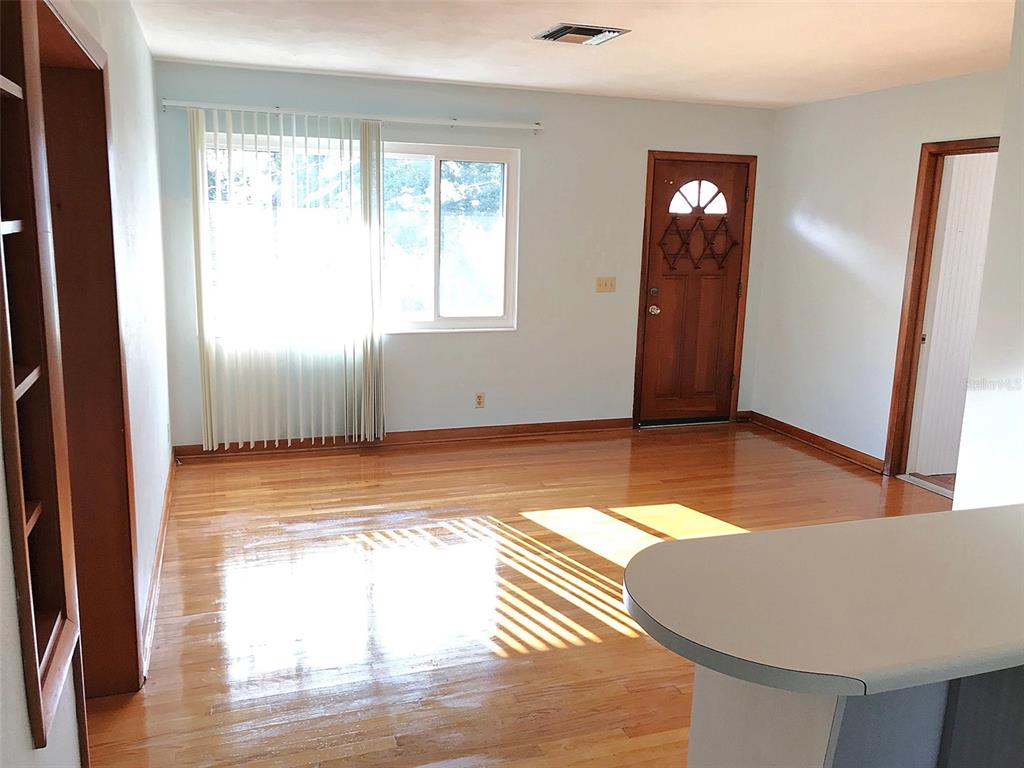 1013 Cody Villa Loop Road Babson Park, FL 33827 - Photo 2 of 6 a view of empty room with wooden floor and fan