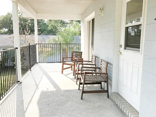 a view of a balcony with chairs