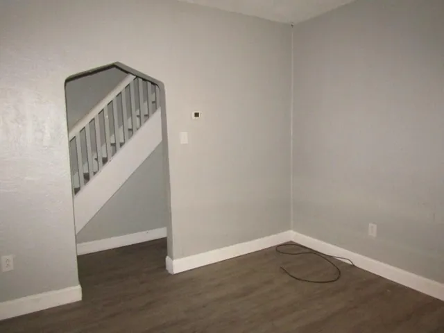 a view of an entryway with wooden floor