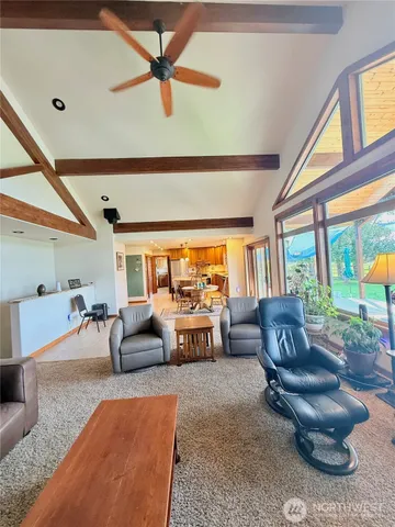 a spacious bedroom with a bed and a large window