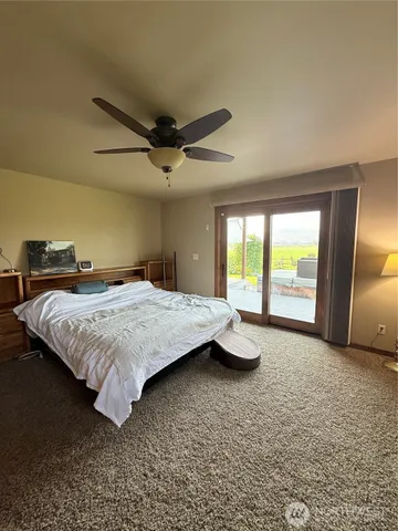 a bedroom with a bed and a cabinets