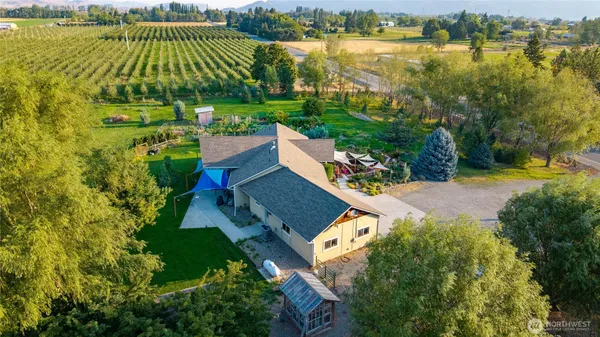 an aerial view of a house with a lake view