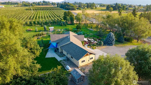 an aerial view of a house with a lake view