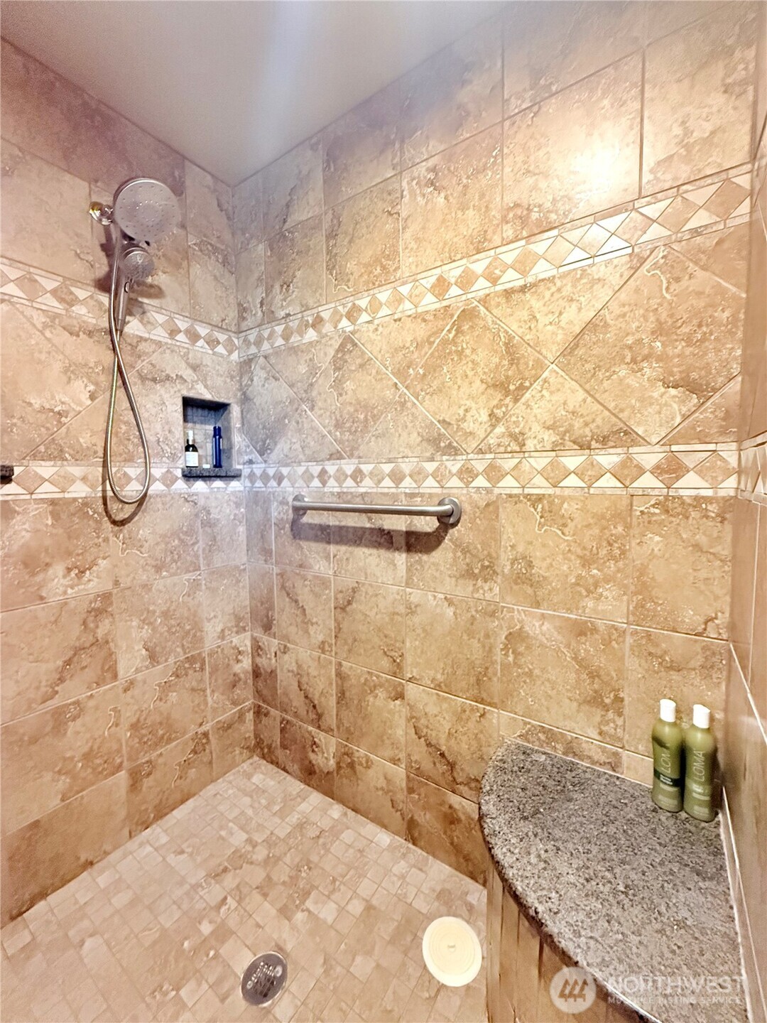 129 Robinson Canyon Road Omak, WA 98841 - Photo 22 of 40 a bathroom with a granite countertop sink a mirror and shower