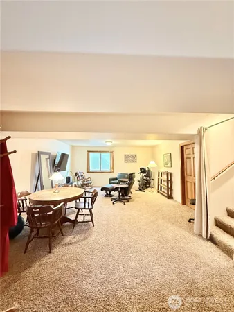 a living room with furniture and a table